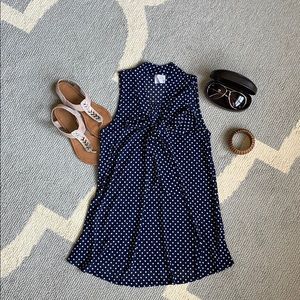 Navy blue with white polka dot maternity top.